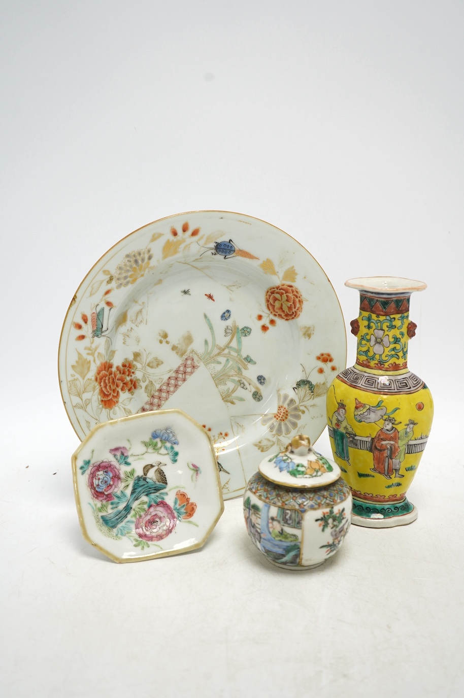 19th century Chinese enamelled porcelain to include a vase, jar & cover, a famille rose dish and a Japanese plate, largest 21.5cm high. Condition - poor to fair